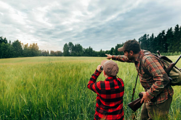 istock Father and Son hunting for boar 825522582
