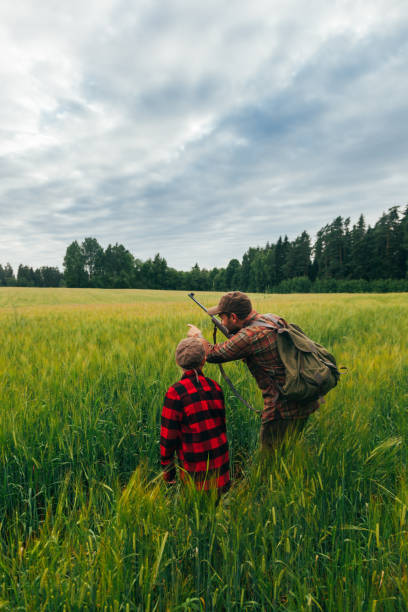 istock Father and Son hunting for boar 825522584