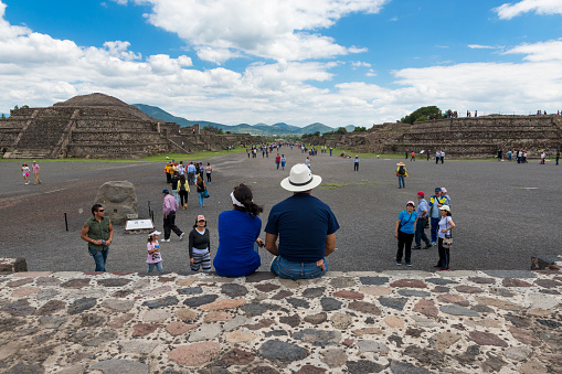 Teotihuacan, State of Mexico, Mexico - June 1, 2014: People at the Avenue of the Dead in the Teotihuacan archaeological site in Mexico. Teotihuacan was one of the largest cities in the pre-Columbian Americas.
