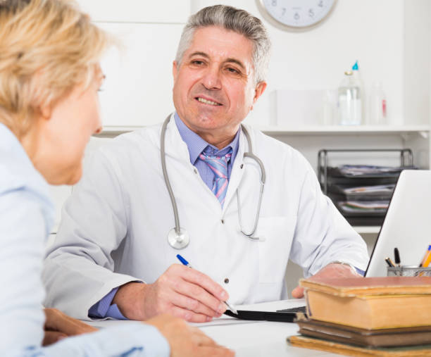 istock Professor of medicine training colleague 825526562