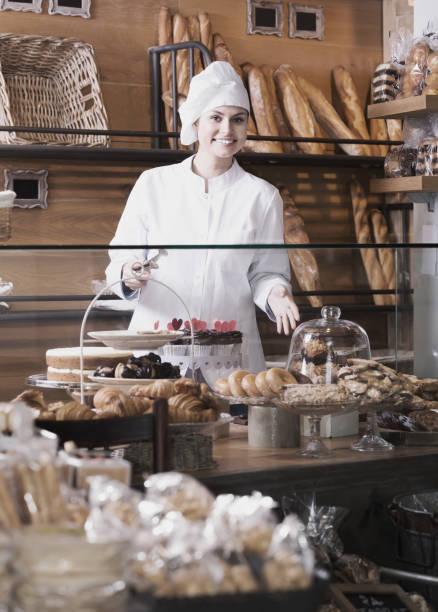 istock Female staff in local bakery 825526752