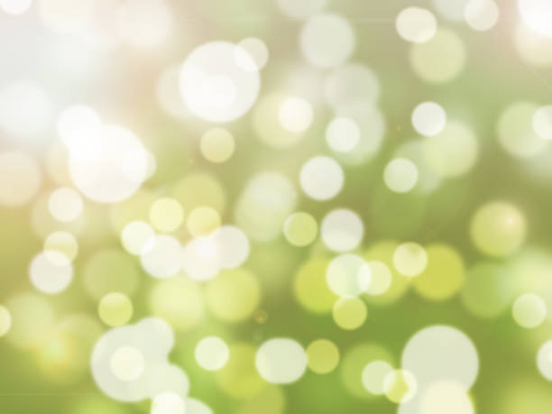 istock Green Bokeh Background with Lens flare. 825527434