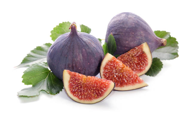 istock fruits of Fig tree (whole and part) with leaves isolated on white 825533966