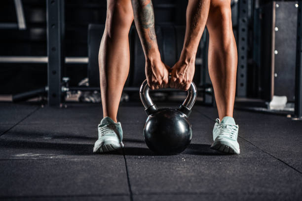 istock Woman in sportswear doing gym workout 825537102