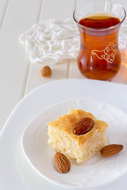 istock Piece Basbousa Traditional Arabic Semolina Cake with Nuts 825538558