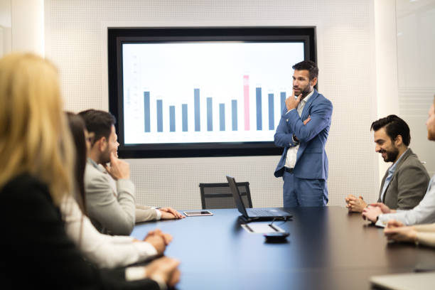 istock Business people having conference meeting at board room 825542080