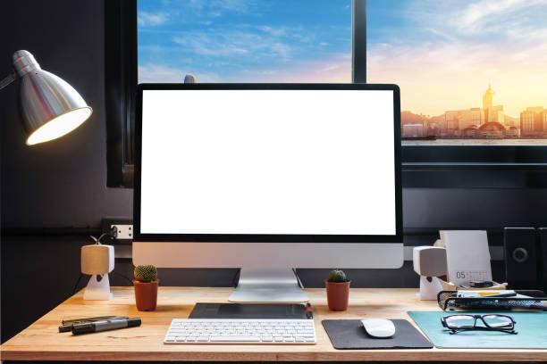 istock Graphic designer's workspace with cityscape view with a pen tablet, a computer and white background for text 825542224