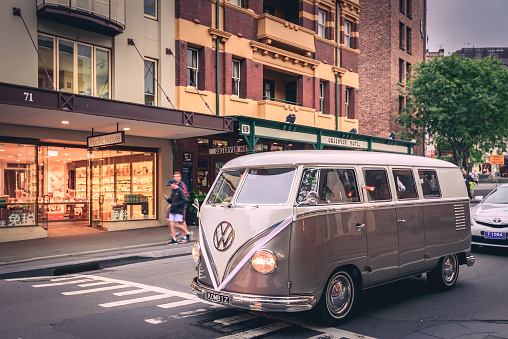 Sydney: Freshly restored Volkswagen Kombi camper van driving along George street at the Rocks, New South Wales