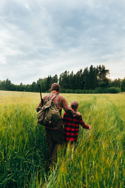 istock Father and Son hunting for boar 825558374