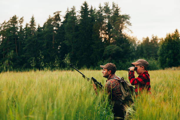 istock Father and Son hunting for boar 825558596