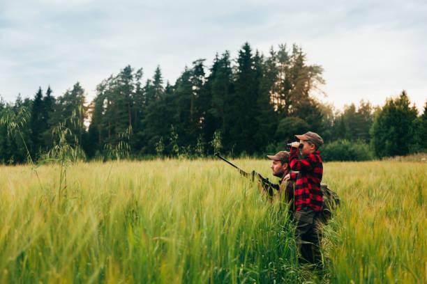 istock Father and Son hunting for boar 825558598