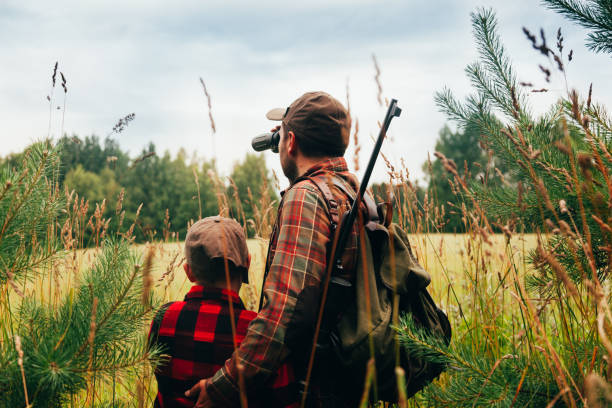 istock Father and Son hunting for boar 825558698