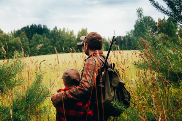 istock Father and Son hunting for boar 825558752