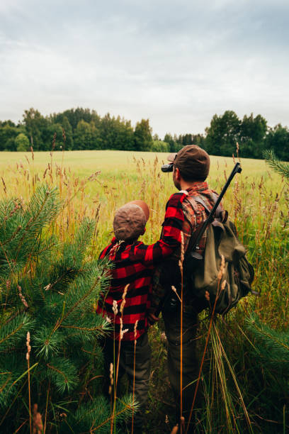istock Father and Son hunting for boar 825558798