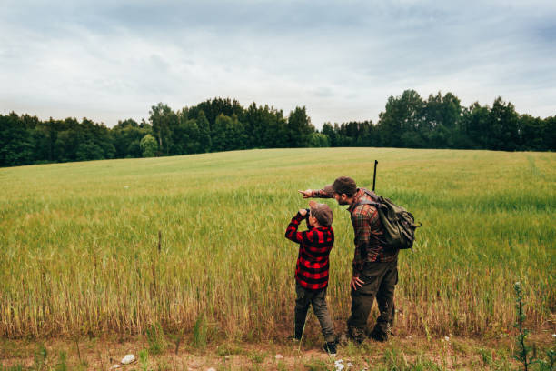 istock Father and Son hunting for boar 825558810