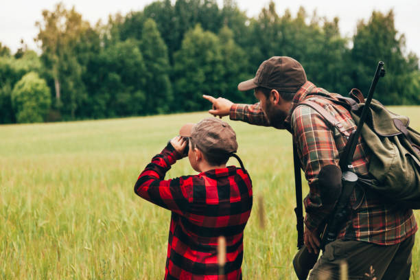istock Father and Son hunting for boar 825558816