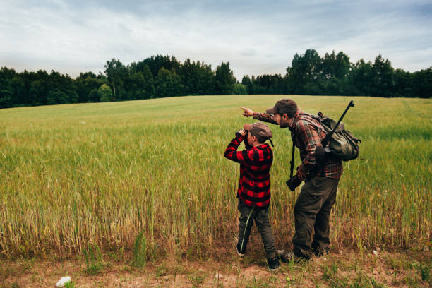 istock Father and Son hunting for boar 825558882