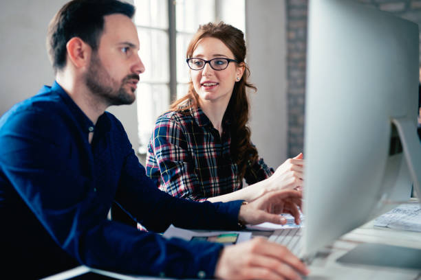 istock Coworking and corporate colleagues working in office 825561538