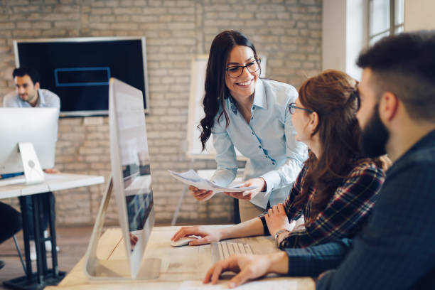 istock Corporate teamworking colleagues in modern office 825561640