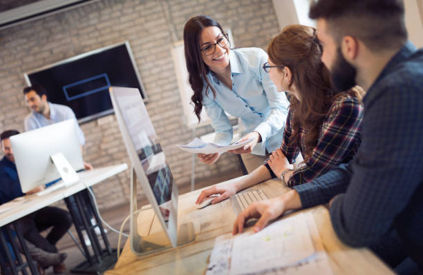istock Corporate teamworking colleagues in modern office 825561646