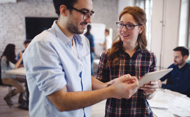 istock Company coworkers working in office 825561766