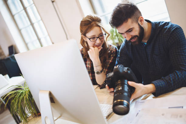 istock Company photo editor and photographer working together 825561830