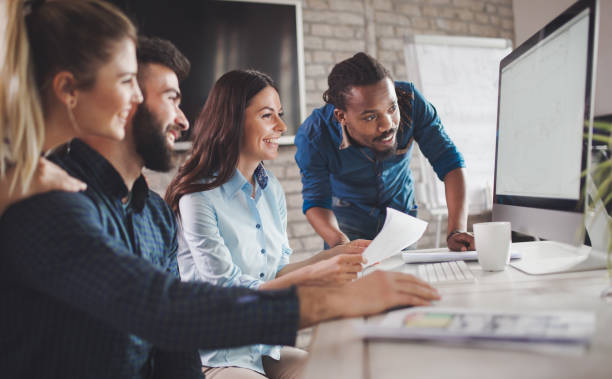istock Corporate teamworking colleagues in modern office 825561868