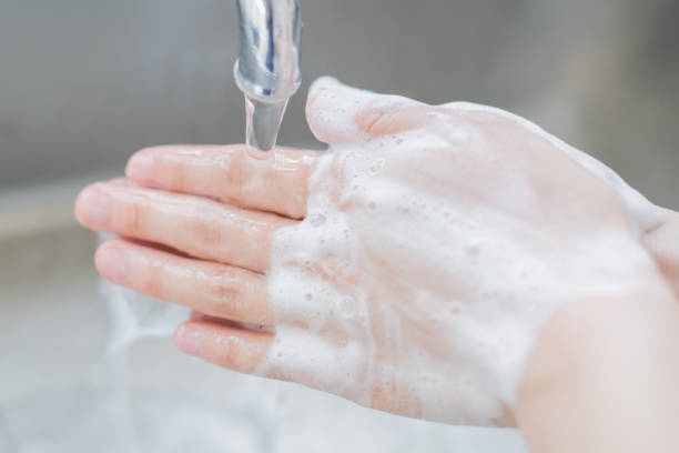 istock Woman washing her hands 825562604