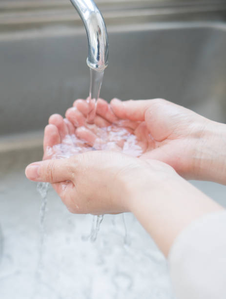 istock Woman washing her hands 825562624