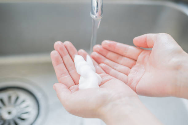 istock Woman washing her hands 825562664
