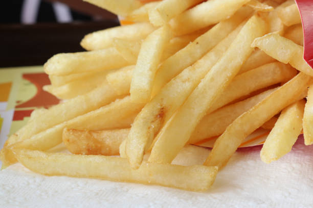 istock French fries on white tissue, close up shot 825565206