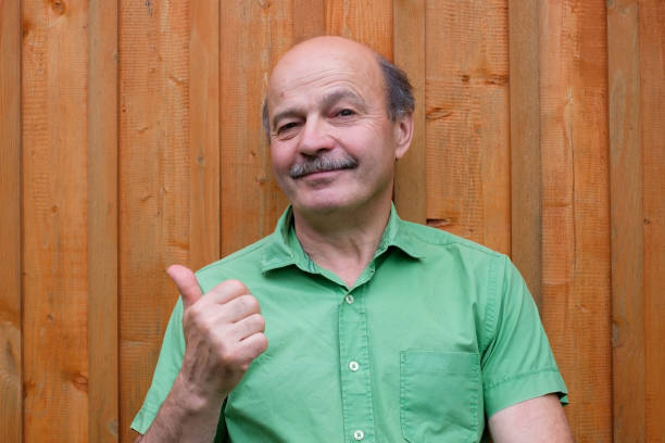 istock Caucasian mature man with thumbs up gesture 825565816