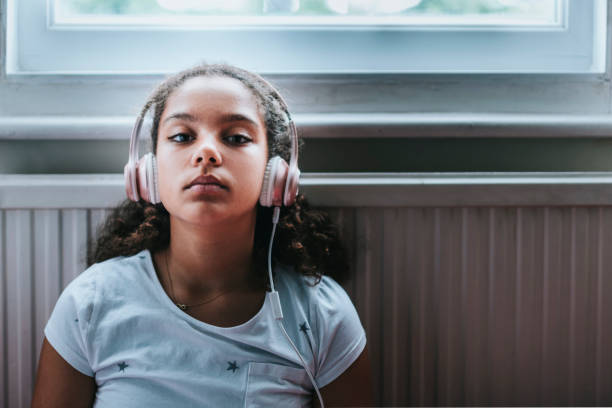Child (11-12) Listening to Music