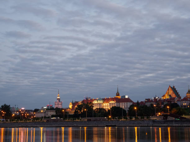 istock Night panorama of Warsaw skyline over Vistula river. 825566562