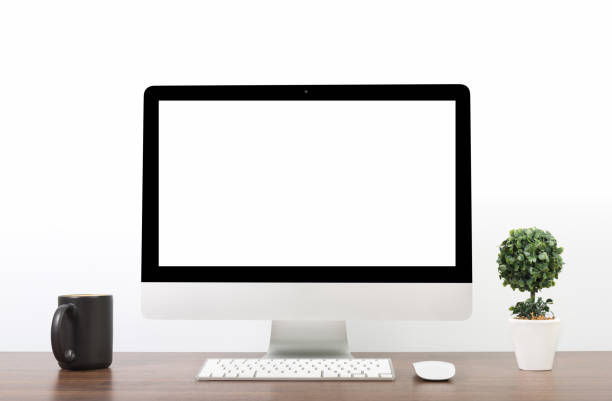 istock Office monitor computer, mouse on wooden table and white wall background 825568822