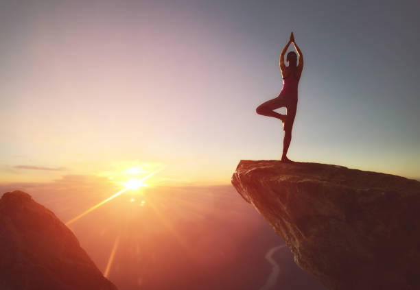istock Woman practices yoga 825570152