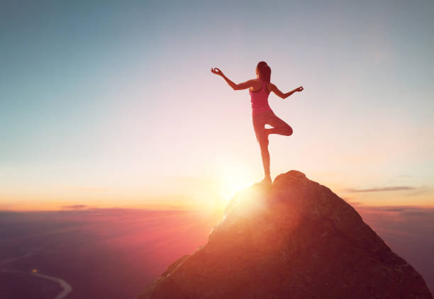 istock Woman practices yoga 825570154
