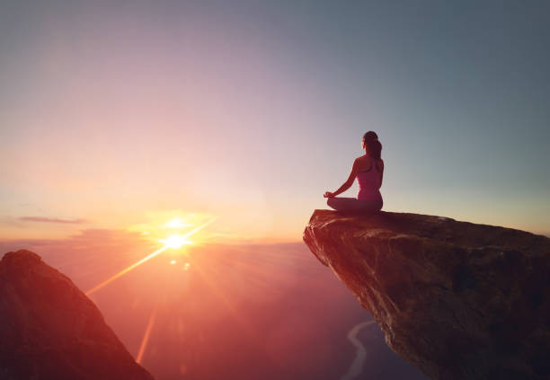 istock Woman practices yoga 825570156
