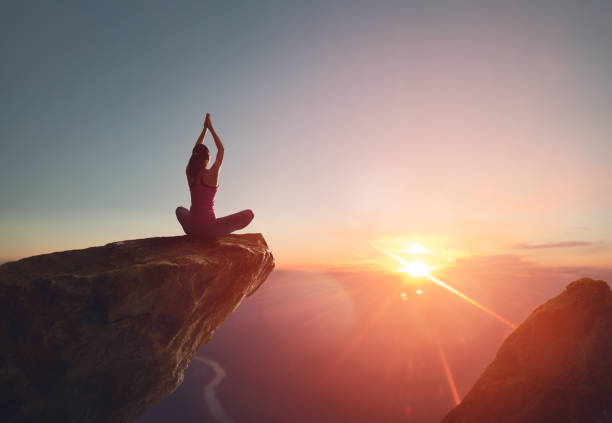 istock Woman practices yoga 825570168
