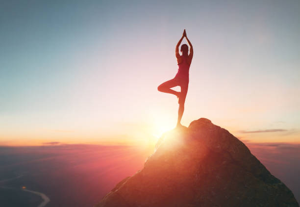 istock Woman practices yoga 825570186