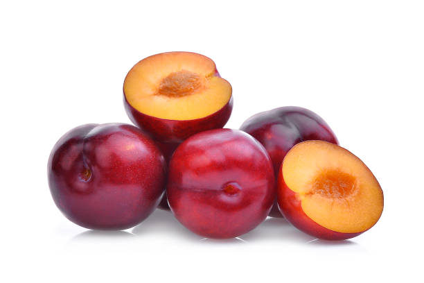 istock whole and half of red cherry plums isolated on white background 825572584