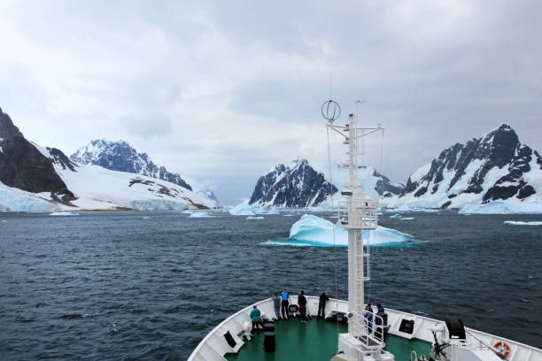 istock Cruise ship crusing around ice floes in Antarctic waters 825576760