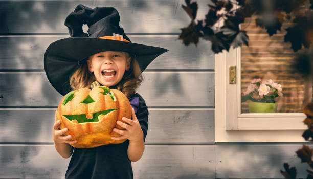 istock little witch outdoors 825576962
