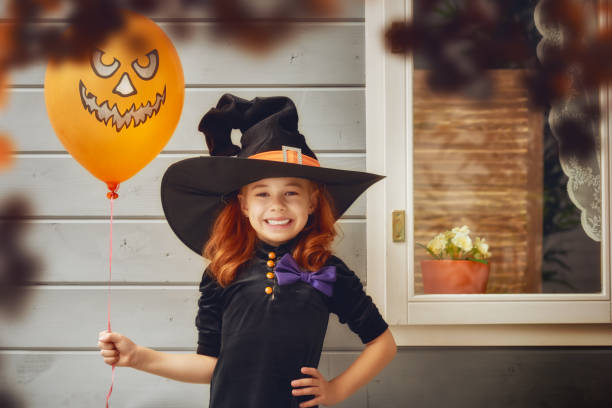 istock little witch outdoors 825576982