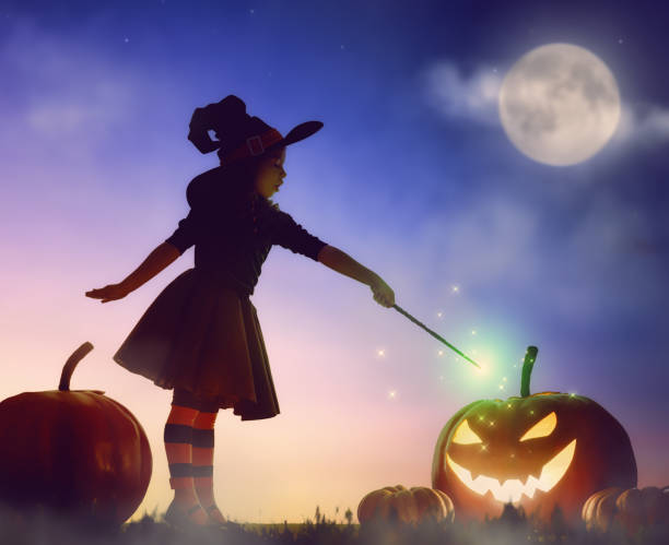 istock little witch outdoors 825577034