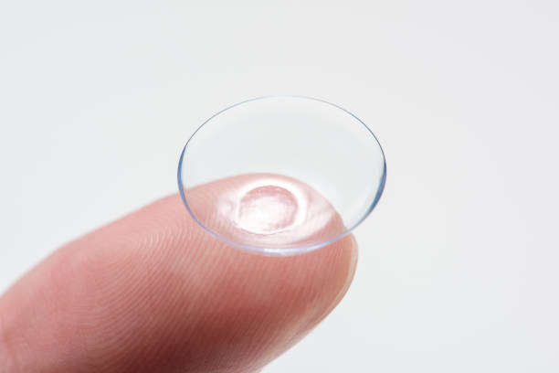 istock Contact lens on fingers 825577468