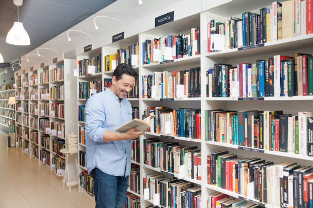 istock Man buying in a bookstore 825577490