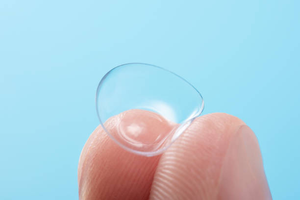 istock Contact lens on fingers 825578004