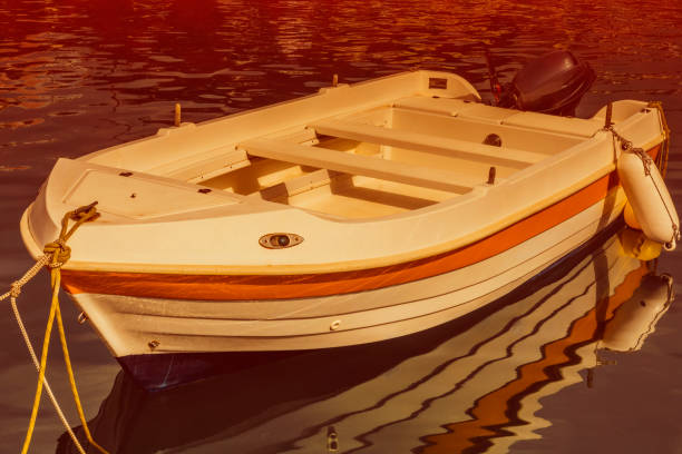 istock Vintage fishing boat in harbor 825581242