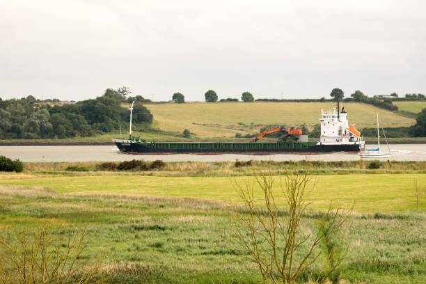 istock British rural seaside countryside view with long boat 825581366
